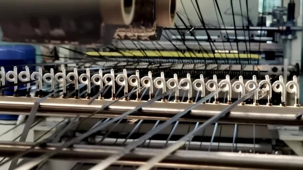 Carbon tows aligned through industrial guide eyelets
