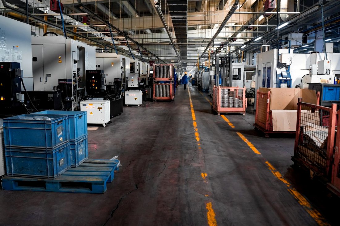 Production floor aisle with CNC and fabrication cells